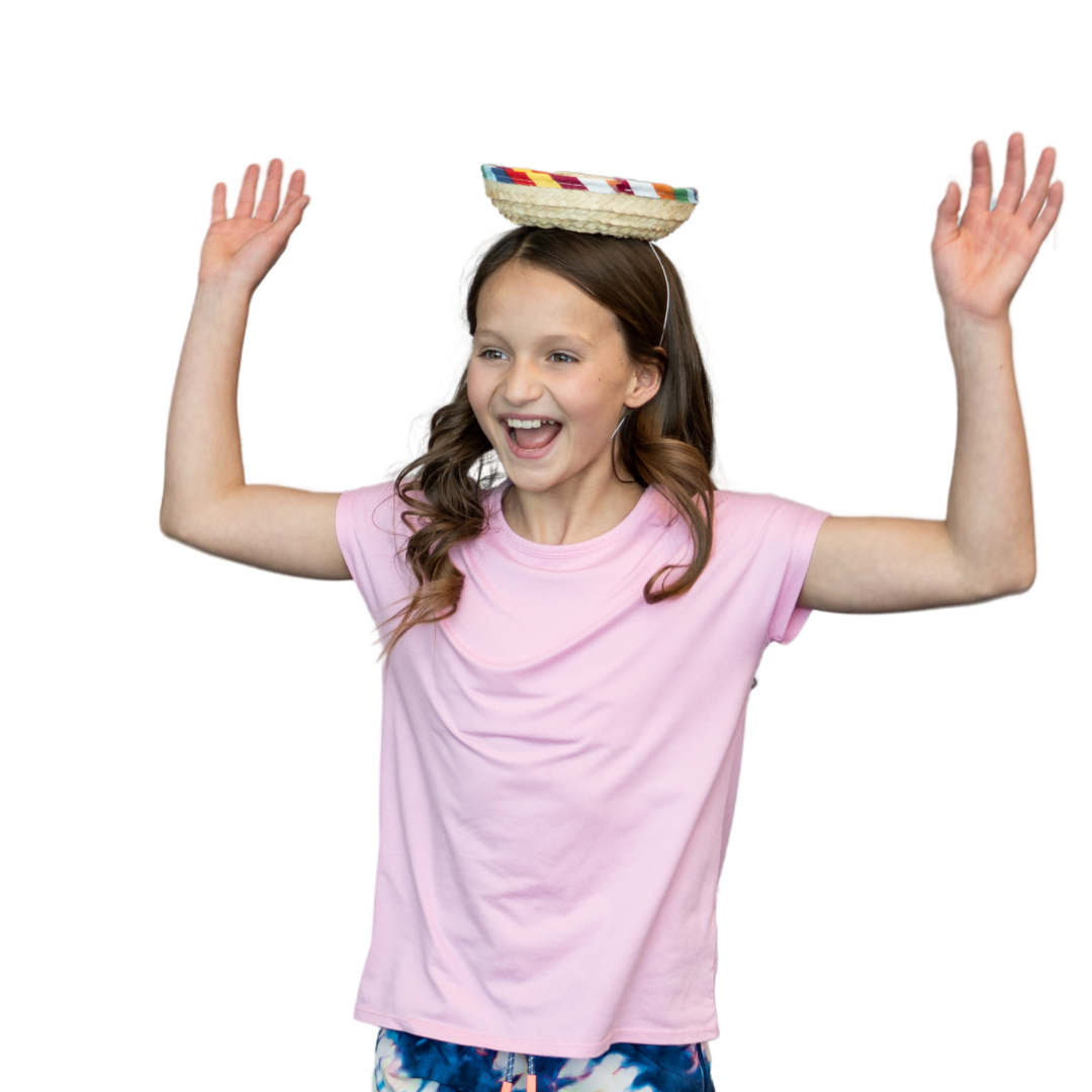 Student wearing a sombrero playing a game for Cinco de Mayo. 